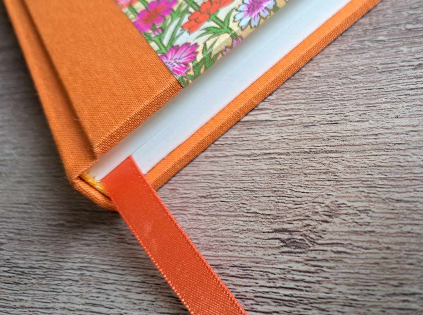 A5 Journal/Notebook (blank) - orange cloth bound with pink floral design front cover