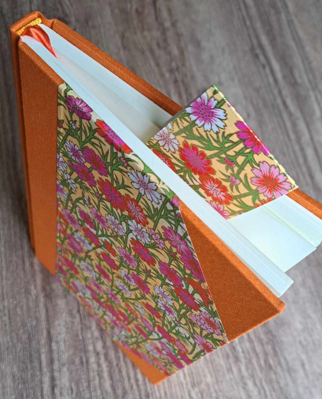 A5 Journal/Notebook (blank) - orange cloth bound with pink floral design front cover