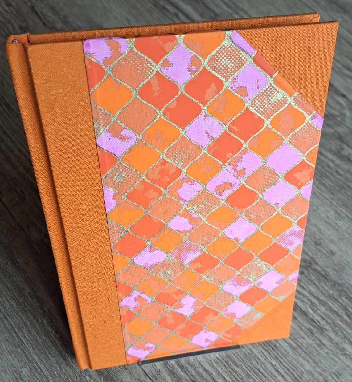 A5 Journal/Notebook (blank) - orange cloth bound with orange and pink geometric design front cover