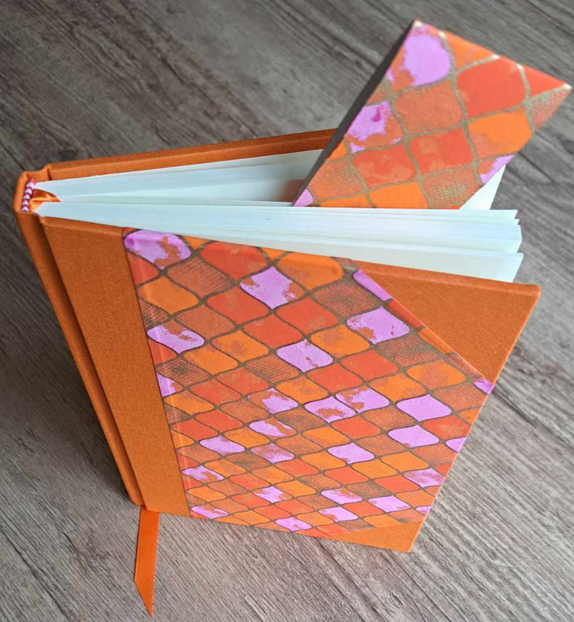 A5 Journal/Notebook (blank) - orange cloth bound with orange and pink geometric design front cover