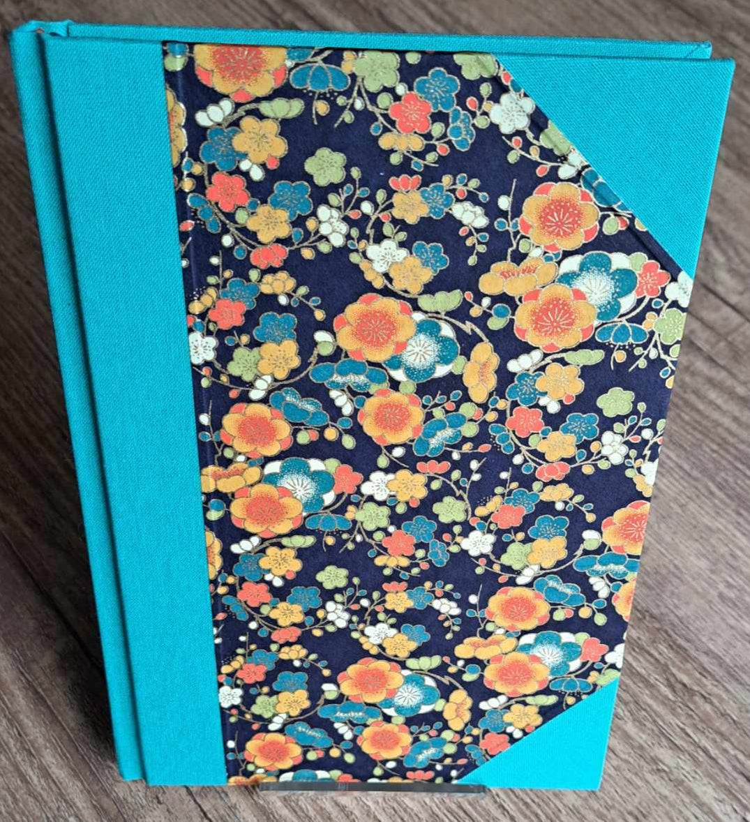 A5 Journal/Notebook (blank) - turquoise cloth bound with orange and blue blossom design front cover