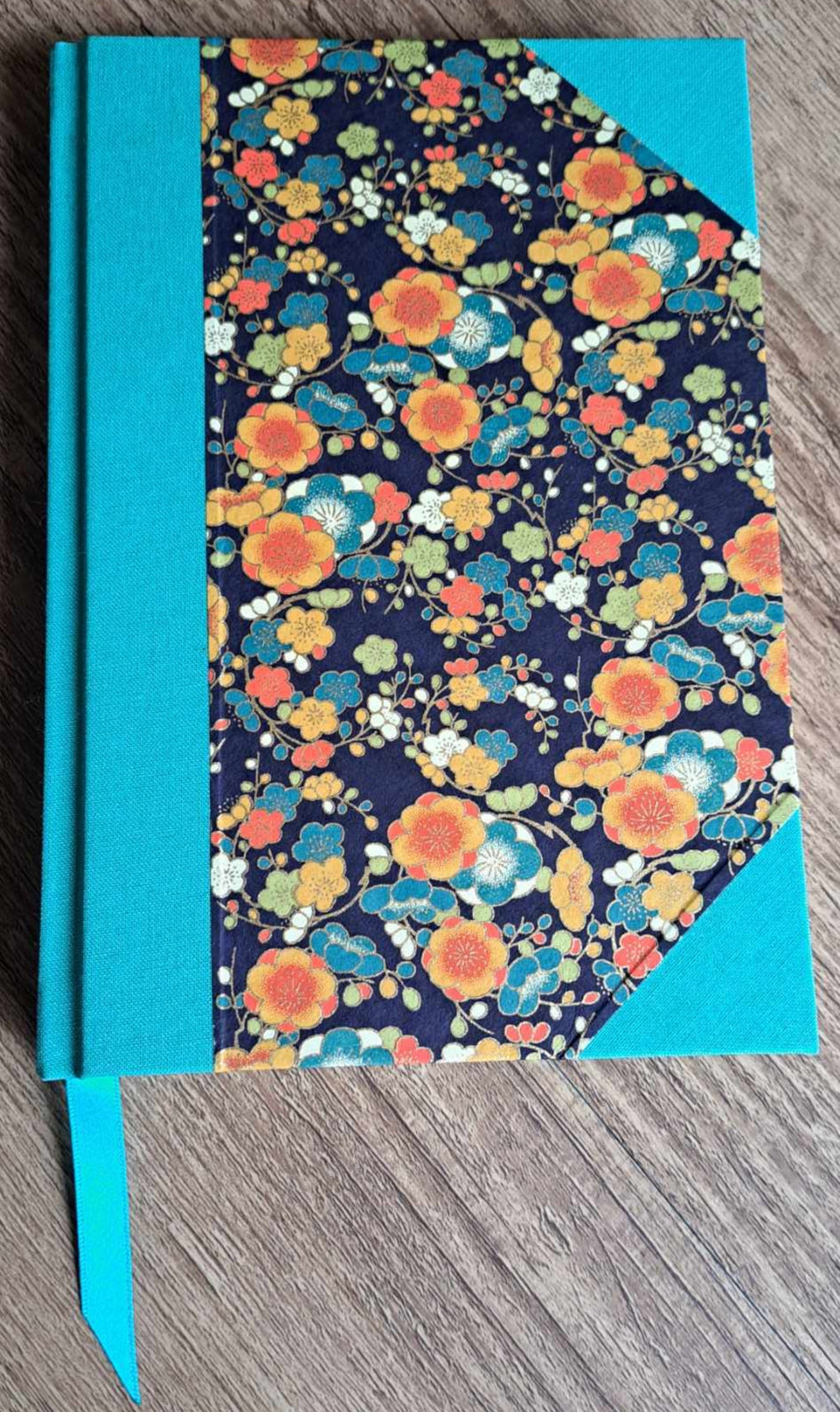 A5 Journal/Notebook (blank) - turquoise cloth bound with orange and blue blossom design front cover