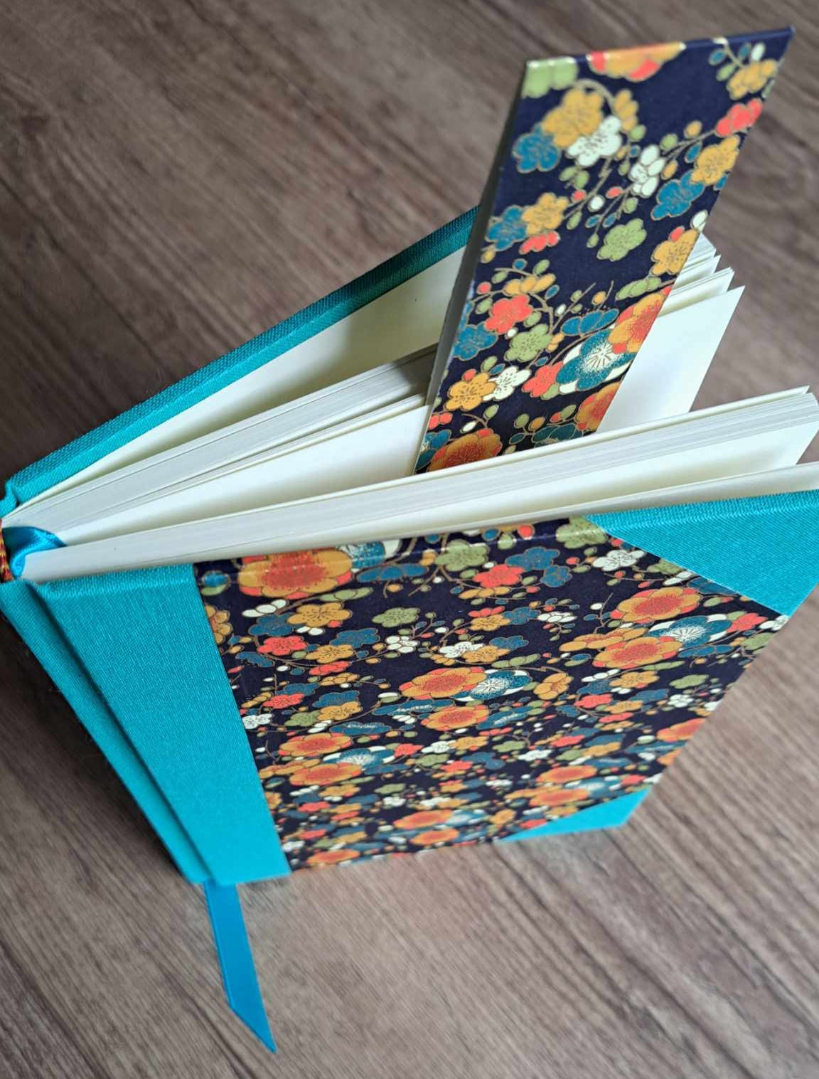 A5 Journal/Notebook (blank) - turquoise cloth bound with orange and blue blossom design front cover