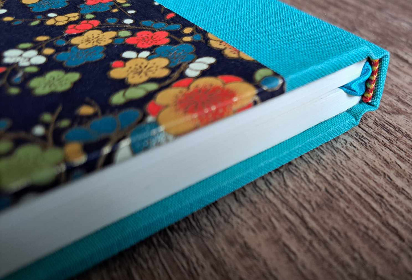 A5 Journal/Notebook (blank) - turquoise cloth bound with orange and blue blossom design front cover