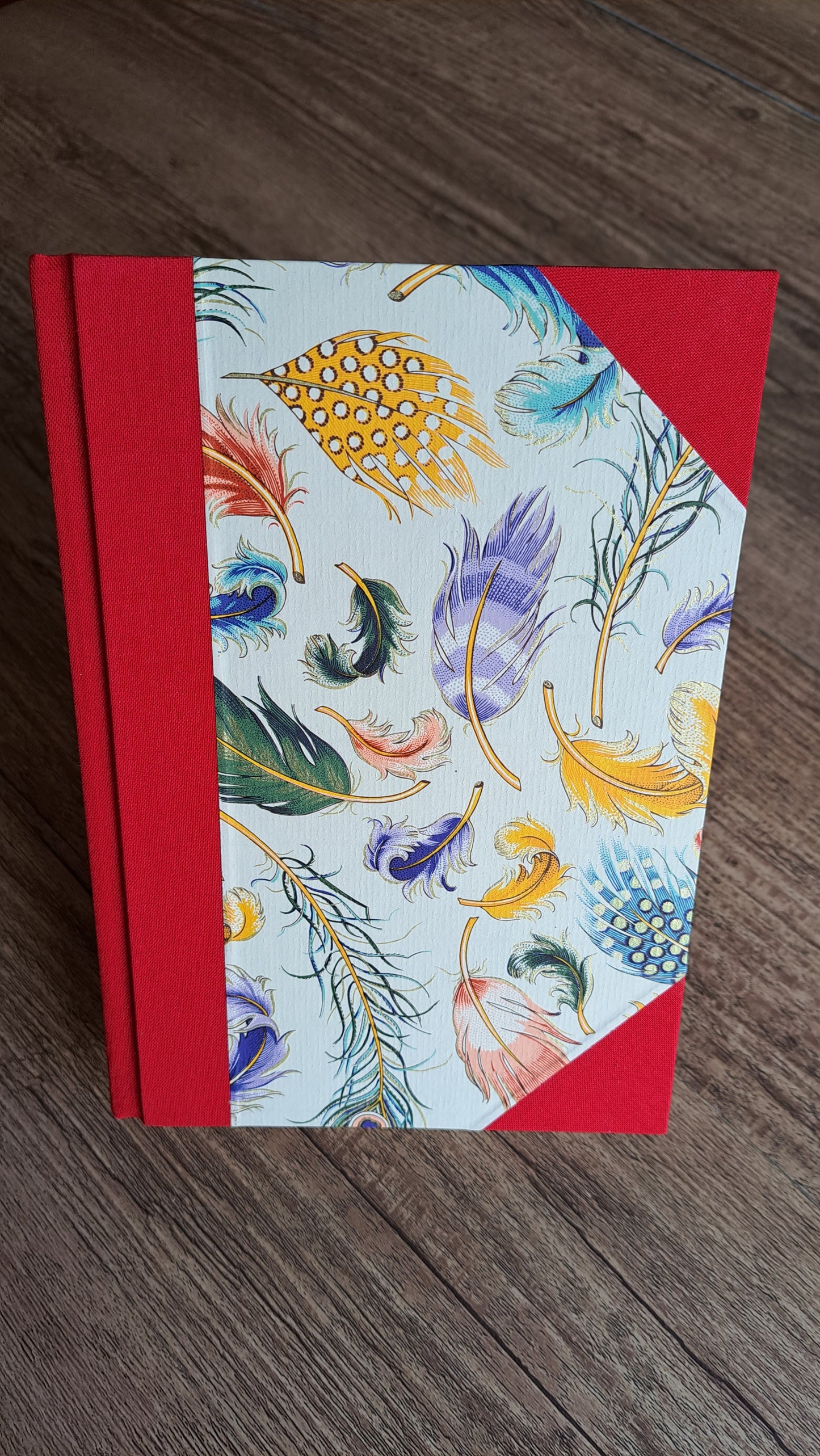 A5 Journal/Notebook (lined) - red cloth bound with peacock design front cover