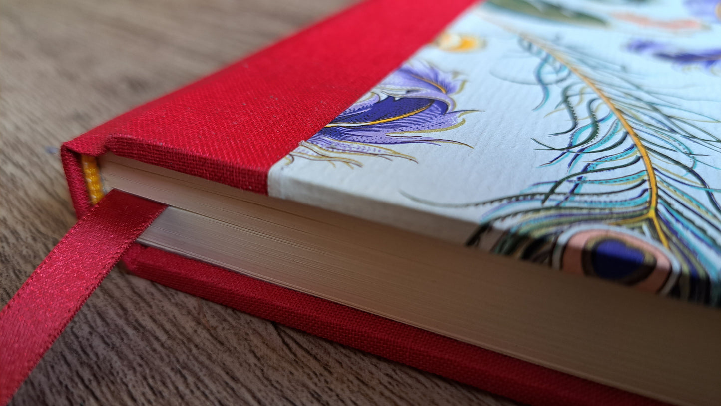 A5 Journal/Notebook (lined) - red cloth bound with peacock design front cover